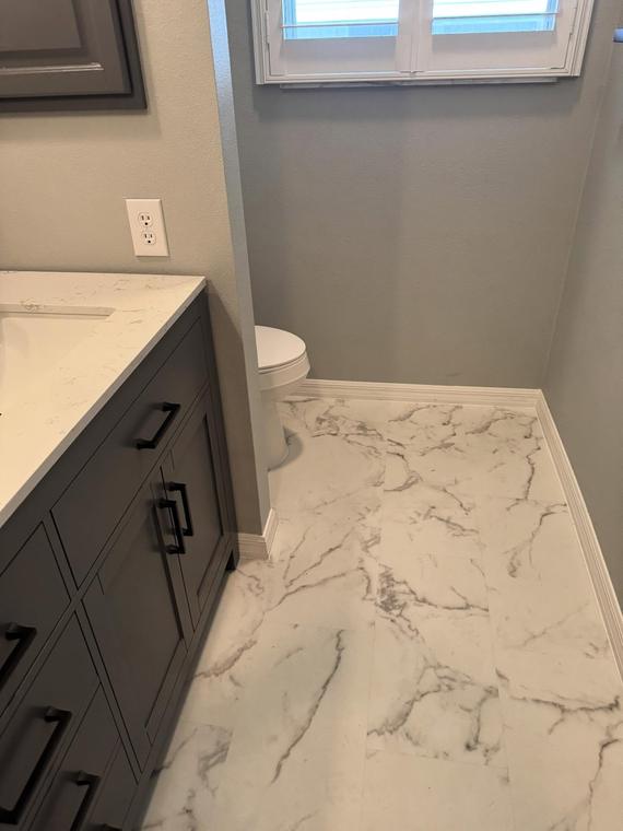 New vanity and marble-look tile flooring