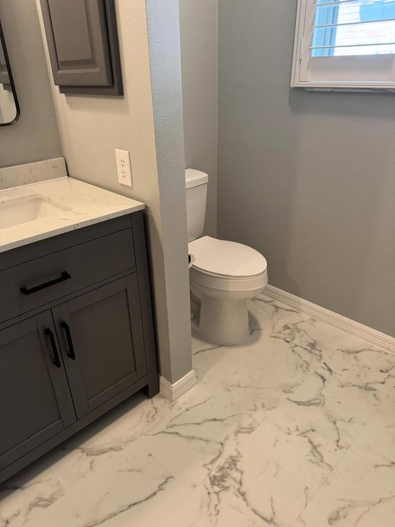 Guest bath remodel with quartz top and tile floor