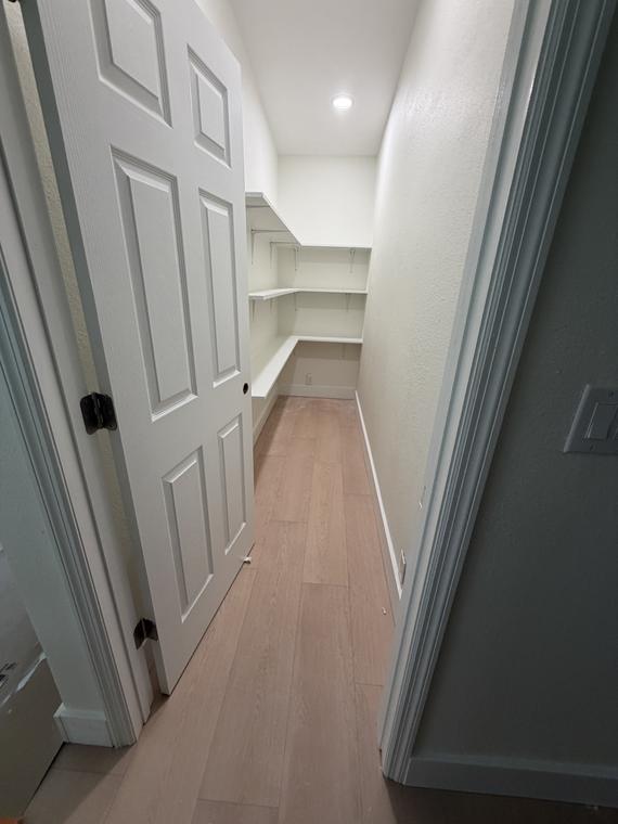 Walk-in pantry with custom shelving