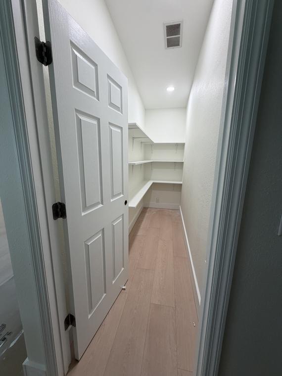 Pantry shelving wrapping the corner