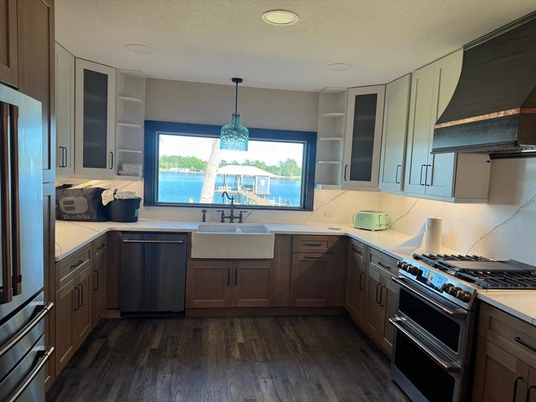 Full kitchen remodel with apron-front sink and stone counters