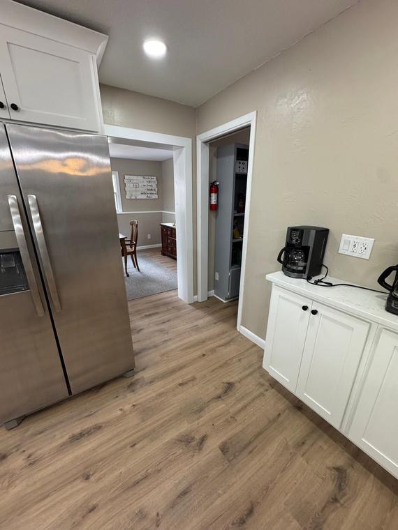 Kitchen refresh with new cabinetry and wide-plank flooring