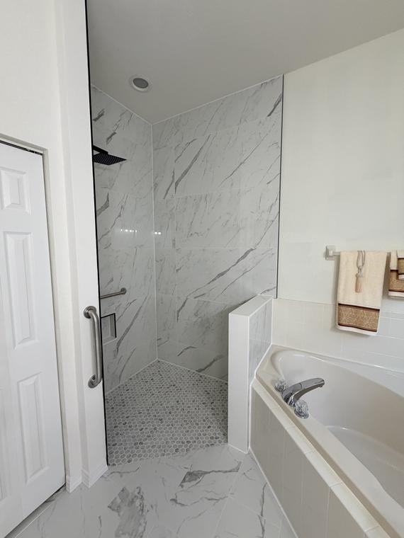 After — the new open shower, with the garden tub alongside