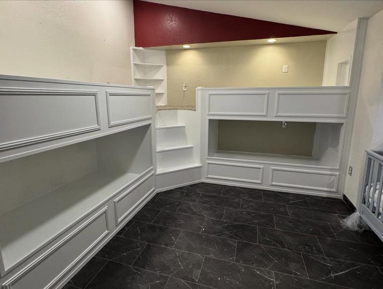 Custom built-in shelving and wainscoting