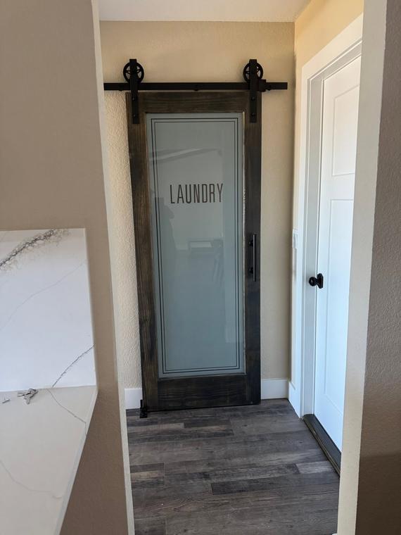 Sliding barn door at the laundry room